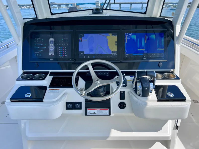 Slide: The Image of Cockpit of 2022 World Cat 400 CC-X with advanced navigation and joystick controls. - 42