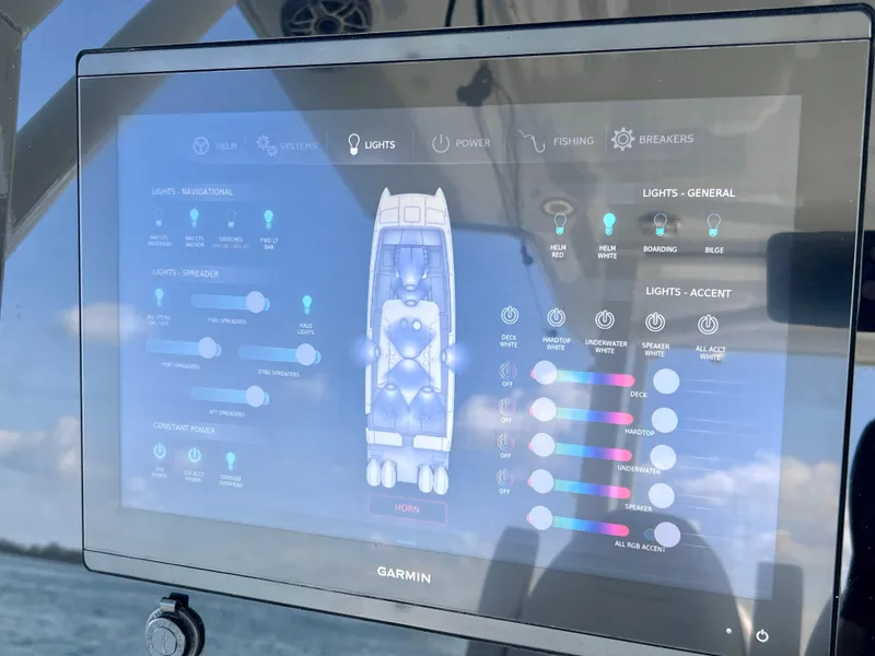 Slide: The Image of Garmin display on World Cat 400 CC-X boat, showing lighting controls and settings. - 47
