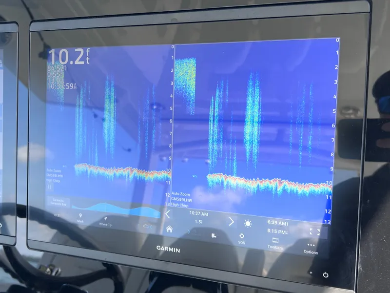 Slide: The Image of Garmin marine display on World Cat 400 CC-X, showing sonar data and depth readings. - 49