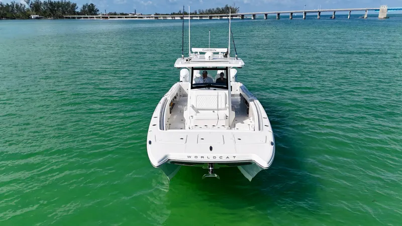 Slide: The Image of 2022 World Cat 400 CC-X boat on turquoise water, featuring night vision and joystick controls. - 5