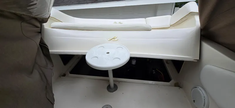 Slide: The Image of 1999 Sea Ray 280 SS boat interior with seating and table. - 17