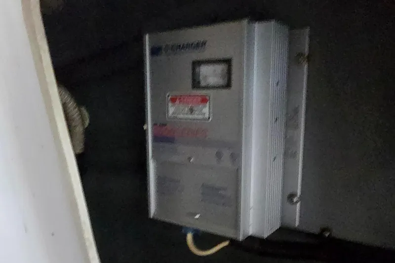 Slide: The Image of Battery charger in a 1999 Sea Ray 280 SS boat interior. - 21