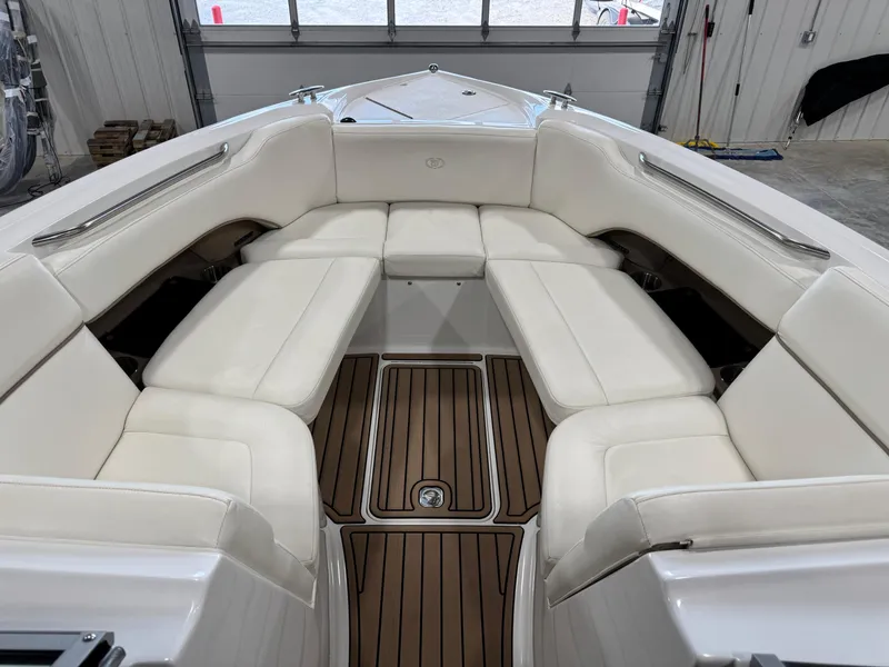 Slide: The Image of 2007 Cobalt 272 BR boat interior with white seating and wooden flooring. - 15