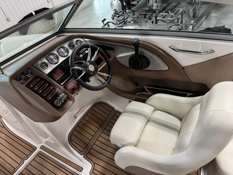 Slide: The Image of 2007 Cobalt 272 BR boat interior with steering wheel and dashboard controls. - 8
