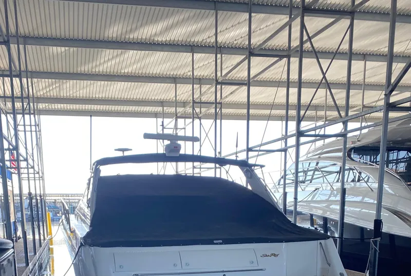 Slide: The Image of 1998 Sea Ray 500 Sundancer yacht docked in a covered marina. - 4