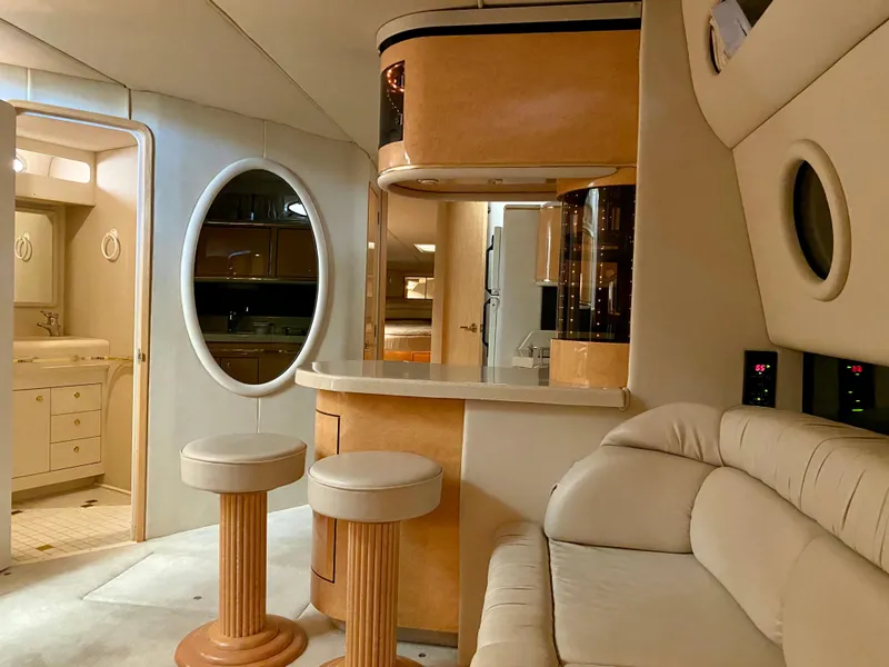Slide: The Image of Luxurious interior of a 1998 Sea Ray 500 Sundancer yacht with modern furnishings. - 6