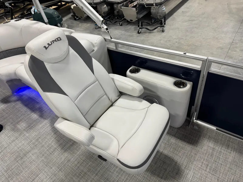 Slide: The Image of Luxurious seating on 2018 Lund LX 240 boat with cup holders. - 10
