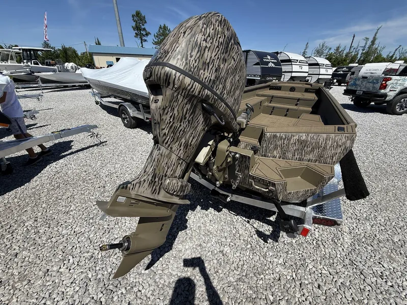 Slide: The Image of 2025 Thor Lake Hammer 1754 TIMBER HAMMER boat with camouflage design on gravel lot. - 6