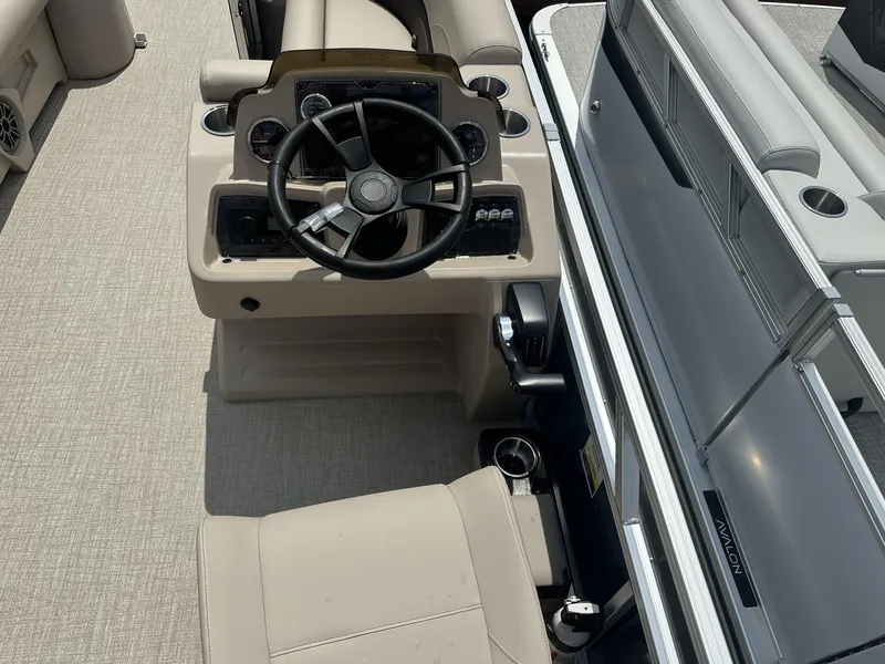 Slide: The Image of 2025 Avalon VLS boat interior with steering wheel and beige seating. - 4