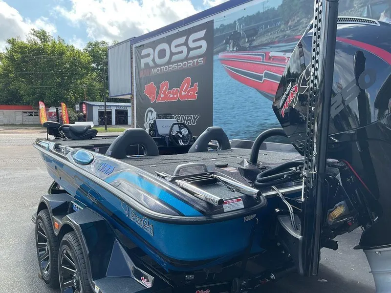 Slide: The Image of 2025 Bass Cat Eyra boat at Ross Motorsports dealership, featuring sleek design and powerful engine. - 11