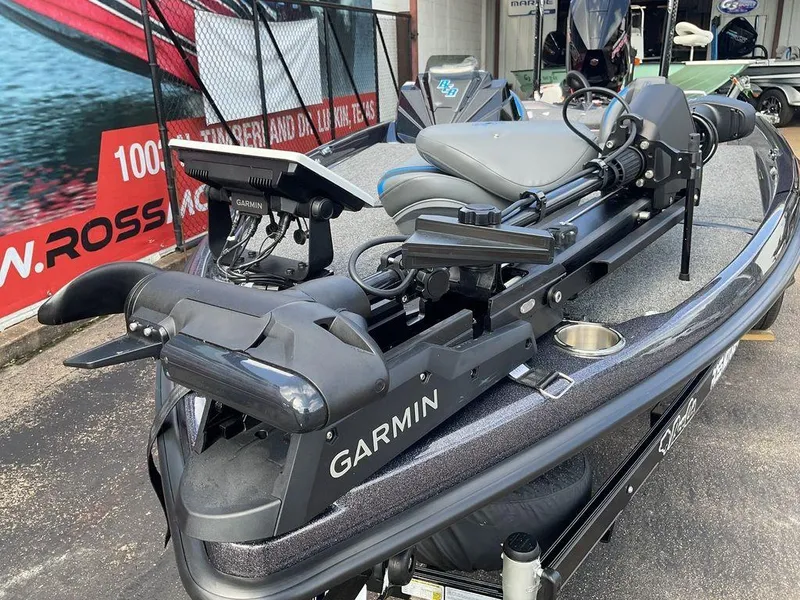 Slide: The Image of 2025 Bass Cat Eyra boat with Garmin equipment, displayed outdoors. - 16