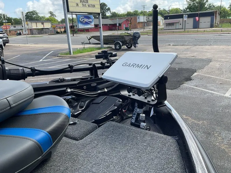 Slide: The Image of 2025 Bass Cat Eyra boat with Garmin navigation system in a parking lot. - 17