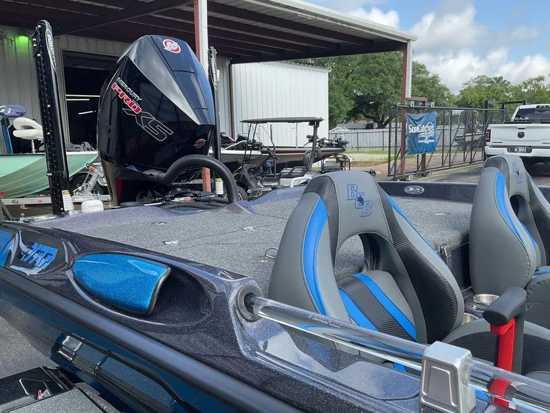 Slide: The Image of 2025 Bass Cat Eyra boat with sleek design and powerful engine, parked outdoors. - 19