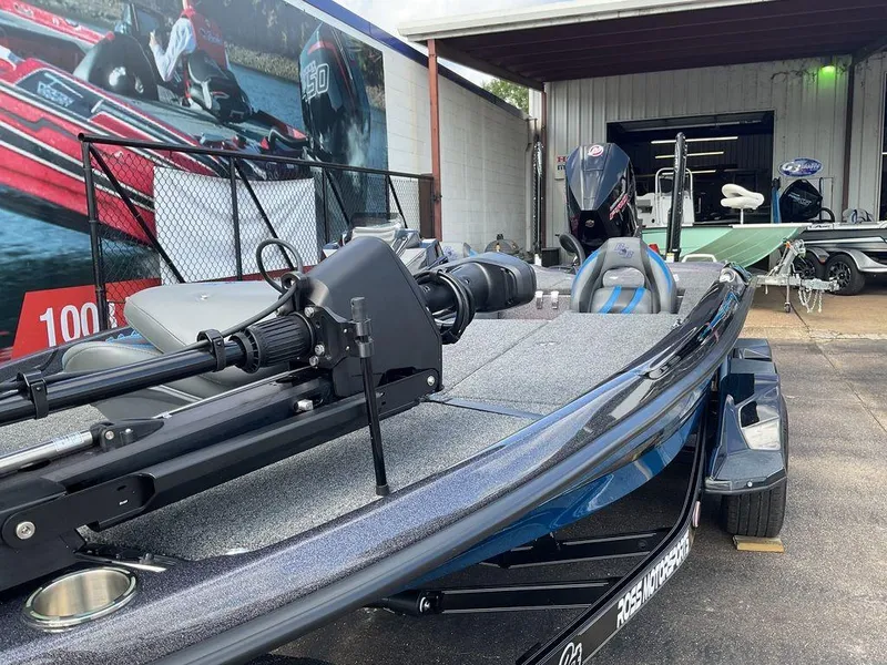 Slide: The Image of 2025 Bass Cat Eyra fishing boat displayed outdoors, featuring sleek design and modern equipment. - 21