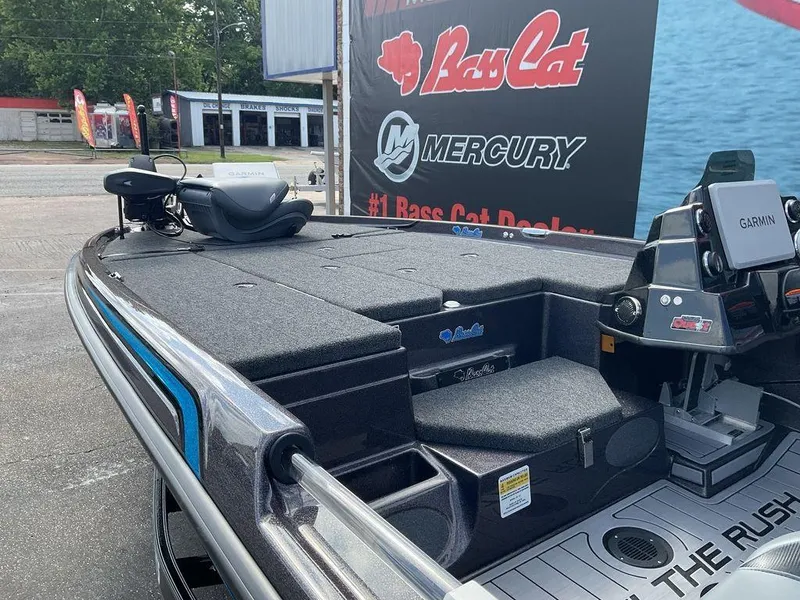 Slide: The Image of 2025 Bass Cat Eyra boat with Garmin system, displayed at a dealership. - 24