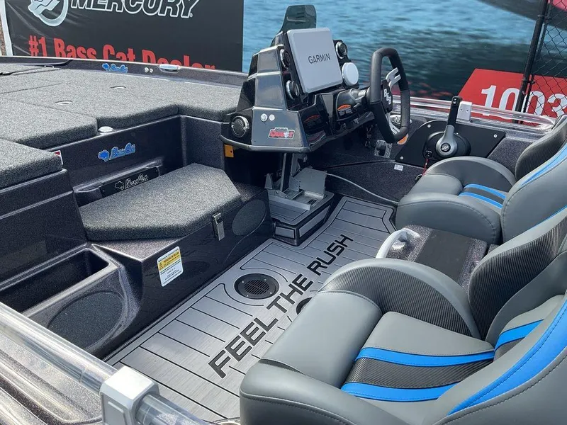 Slide: The Image of 2025 Bass Cat Eyra boat interior with Garmin system and comfortable seating. - 25