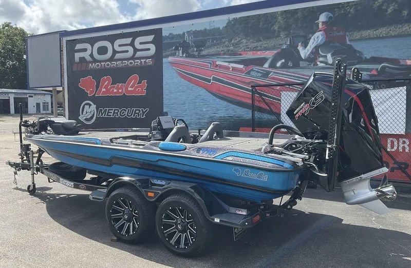 Slide: The Image of 2025 Bass Cat Eyra boat at Ross Motorsports dealership, featuring sleek design and Mercury engine. - 6