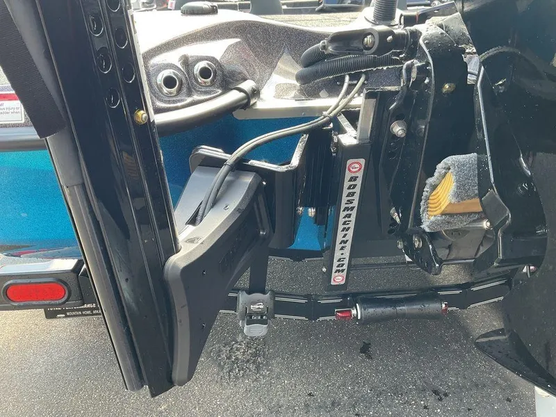 Slide: The Image of 2025 Bass Cat Eyra boat with hydraulic jack plate and steering components. - 7