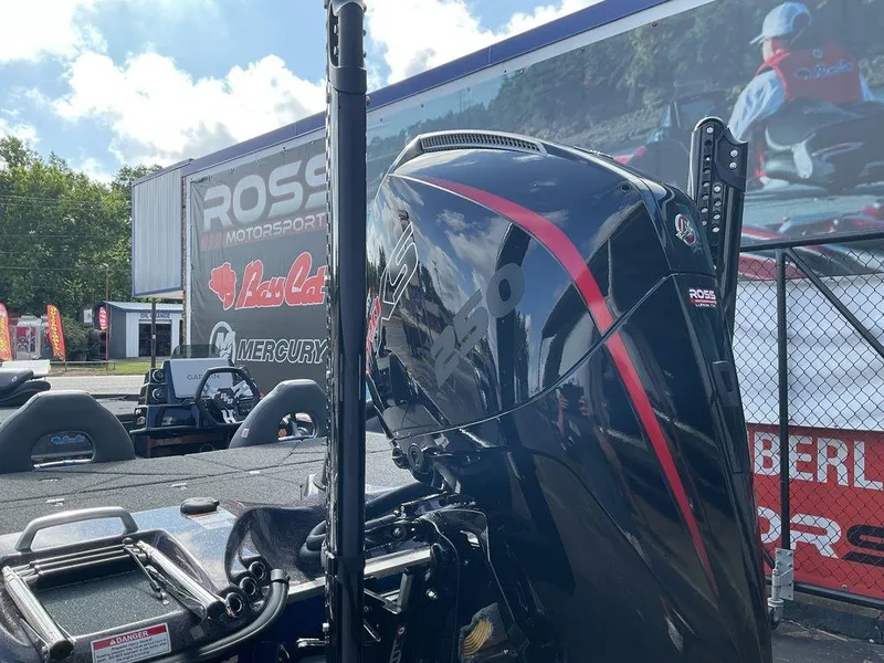 Slide: The Image of 2025 Bass Cat Eyra boat with powerful engine at Ross Motorsports display. - 9