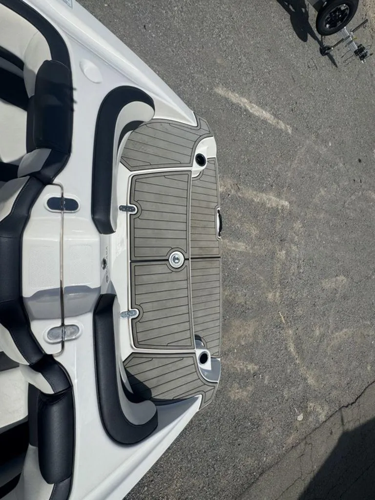 Slide: The Image of 2021 Yamaha Boats AR195 swim platform with cushioned seating and gray decking. - 7