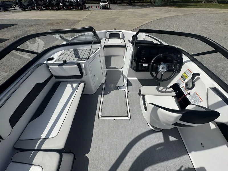 Slide: The Image of 2021 Yamaha Boats AR195 interior with sleek seating and modern dashboard design. - 8