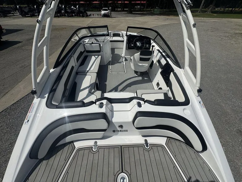 Slide: The Image of 2021 Yamaha Boats AR195 interior with sleek seating and modern dashboard design. - 9