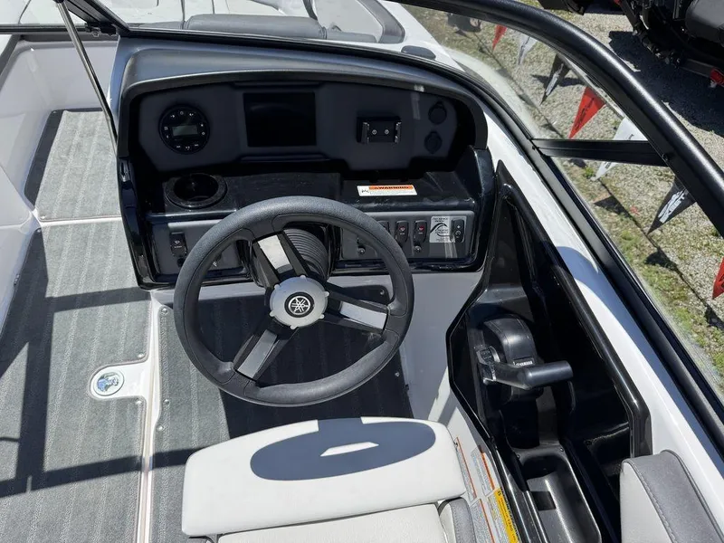 Slide: The Image of 2024 Yamaha AR190 boat cockpit with steering wheel and control panel. - 3