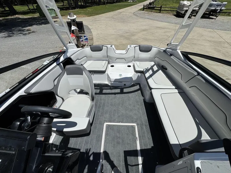 Slide: The Image of 2024 Yamaha Boats AR190 interior with spacious seating and modern design. - 7