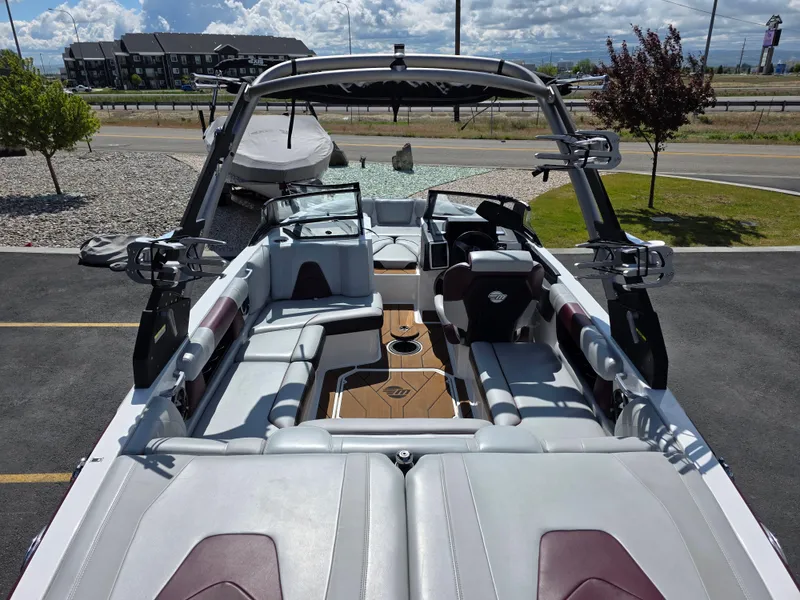 Slide: The Image of 2020 Malibu 21VLX boat interior with sleek seating and modern design. - 11