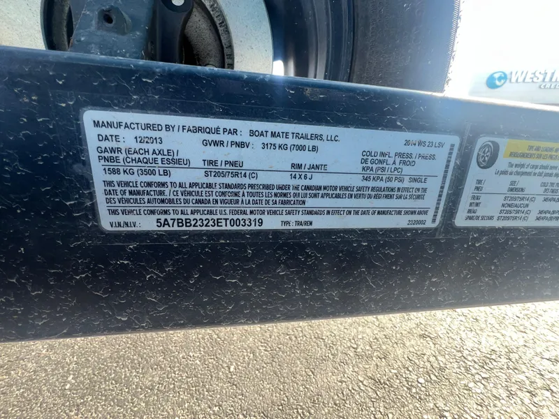 Slide: The Image of Trailer label for 2014 Malibu W23LSV, detailing specifications and compliance information. - 20
