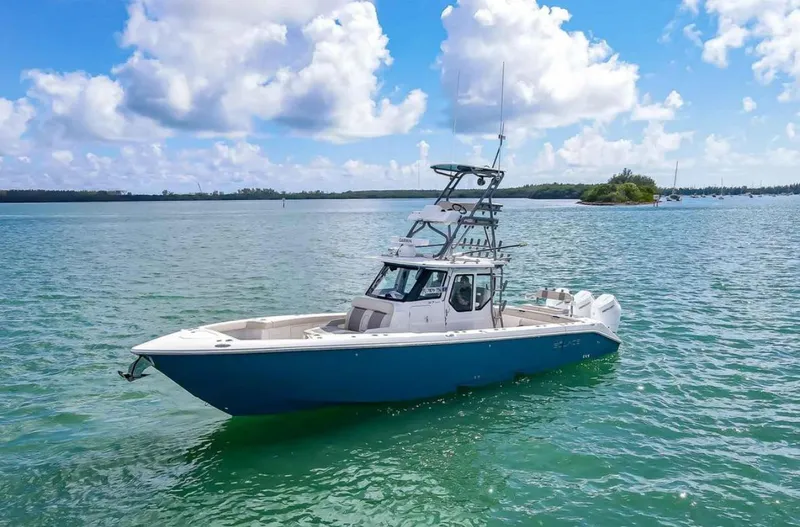 Slide: The Image of 2025 Solace 37 PILOT boat on clear blue water under a bright sky. - 10