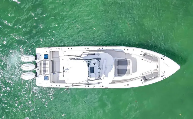 Slide: The Image of Aerial view of 2025 Solace 37 PILOT boat on green water. - 2