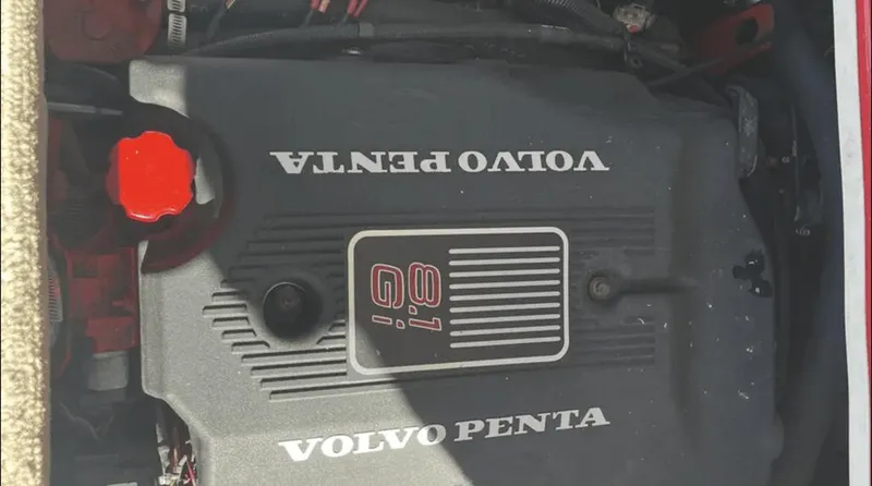 Slide: The Image of Volvo Penta engine in 2002 Crownline 225LPX boat, featuring red cap and branding. - 11