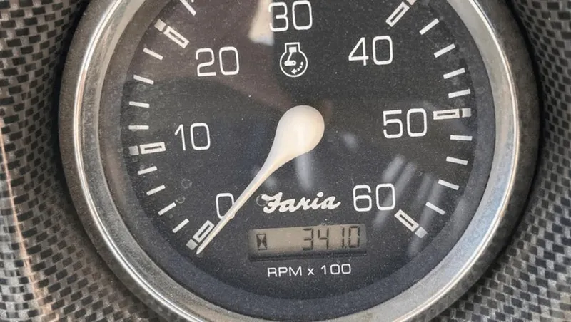 Slide: The Image of Tachometer of 2002 Crownline 225LPX showing 3410 RPM, black dial, silver rim. - 6