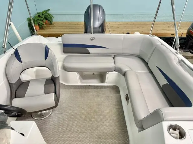 Slide: The Image of 2018 Hurricane SS 188 OB boat interior with cushioned seating and steering wheel. - 3