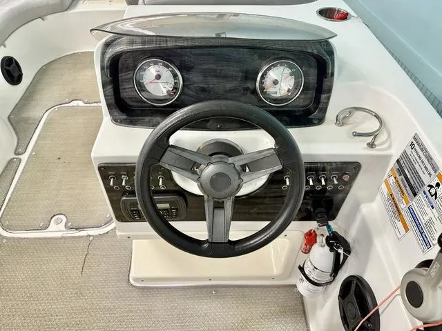 Slide: The Image of Steering console of 2018 Hurricane SS 188 OB boat with gauges and controls. - 5