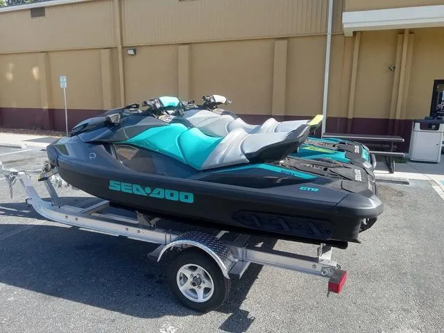 Slide: The Image of 2025 Sea-Doo Waverunner GTR™ 230 Ibr on trailer, parked outdoors. - 14