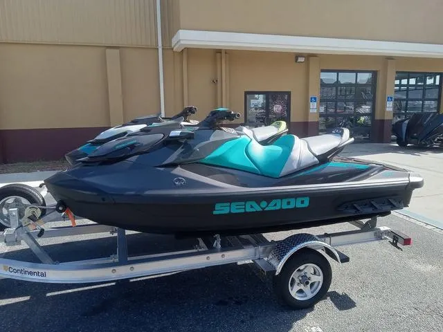 Slide: The Image of 2025 Sea-Doo Waverunner GTR™ 230 Ibr on trailer, parked outside a building. - 8