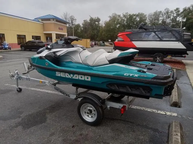 Slide: The Image of 2025 Sea-Doo GTX Waverunner on trailer in parking lot. - 11