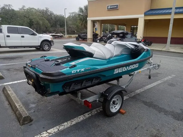 Slide: The Image of 2025 Sea-Doo GTX Waverunner on trailer in parking lot. - 14