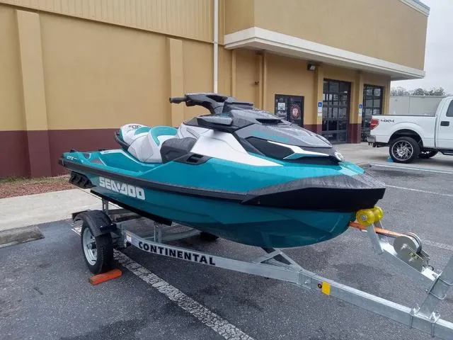 Slide: The Image of 2025 Sea-Doo Waverunner GTX on trailer, parked outside a building. - 4