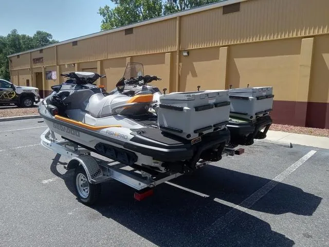 Slide: The Image of 2025 Sea-Doo Waverunner FISH PRO on trailer, parked outdoors, with fishing gear. - 15