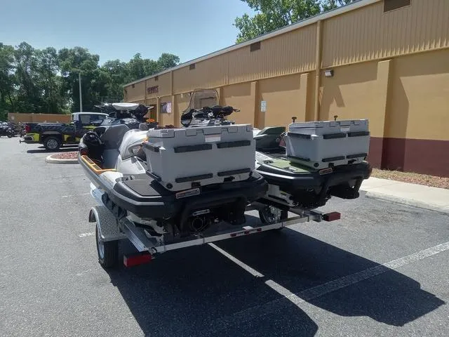 Slide: The Image of 2025 Sea-Doo Waverunner FISH PRO on trailer, parked outside a building. - 16