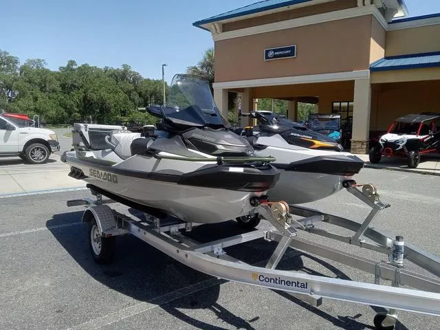 Slide: The Image of 2025 Sea-Doo Waverunner FISH PRO on trailer outside dealership. - 3