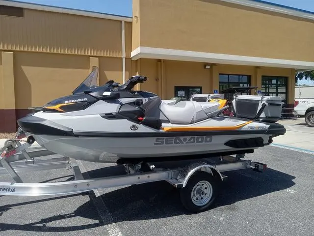 Slide: The Image of 2025 Sea-Doo Waverunner FISH PRO on trailer, parked outside a building. - 8