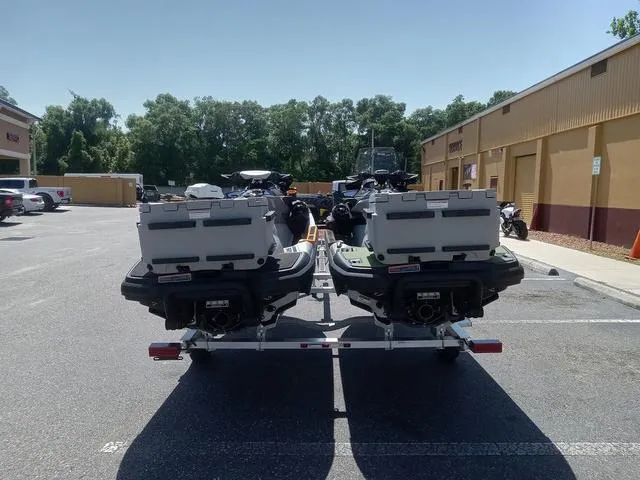 Slide: The Image of 2025 Sea-Doo Waverunner FISH PROs on trailer in parking lot, sunny day. - 9