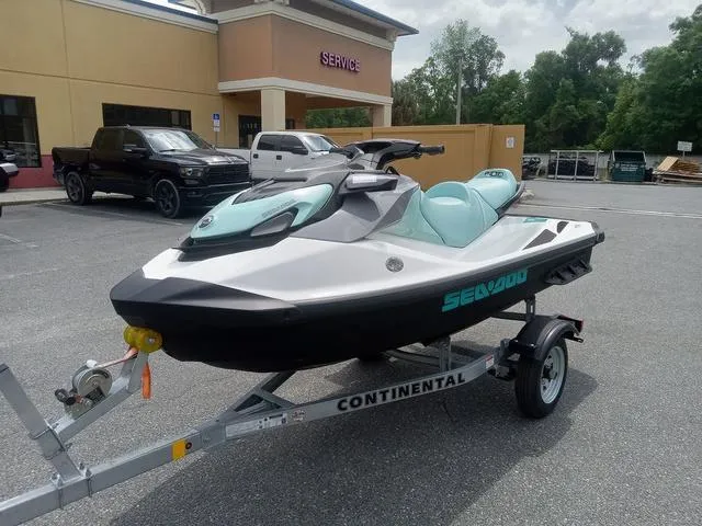 Slide: The Image of 2025 Sea-Doo Waverunner GTI on trailer, parked outside service center. - 7
