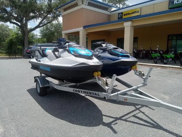 Slide: The Image of 2025 Sea-Doo Waverunner FISH PROs on trailer outside dealership. - 3