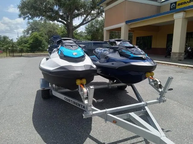 Slide: The Image of 2025 Sea-Doo Waverunner FISH PRO models on a trailer outside a dealership. - 4