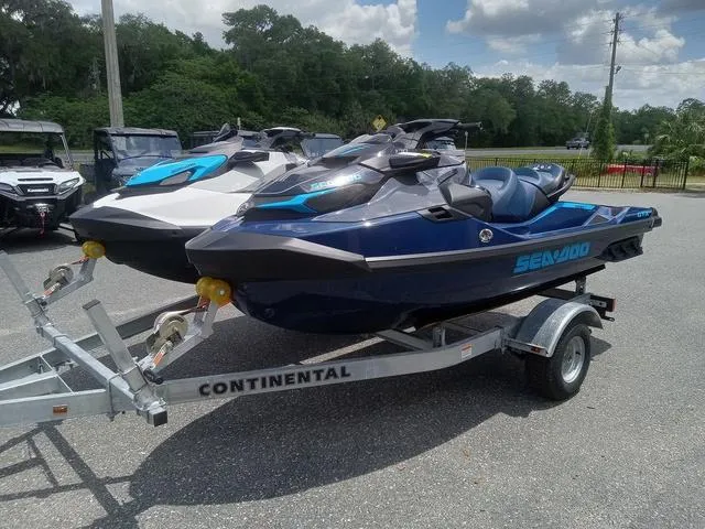 Slide: The Image of 2025 Sea-Doo Waverunner FISH PRO on trailer, parked outdoors under a cloudy sky. - 7